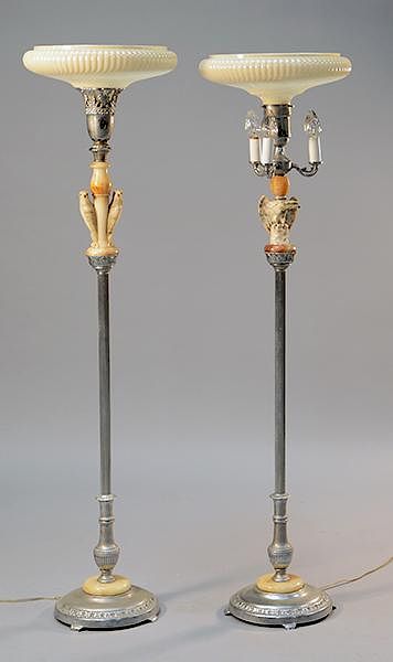 Appraisal: Two similar alabaster and metal eagle torchieres with ribbed glass