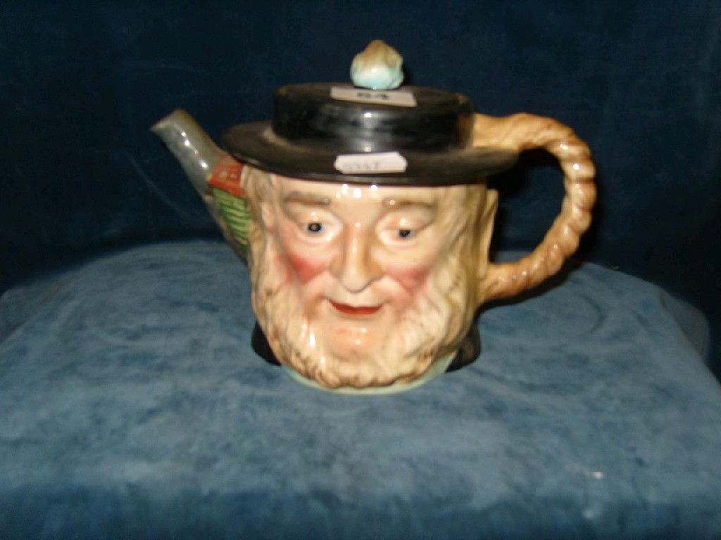 Appraisal: A Beswick teapot and cover in the form of Peggotty