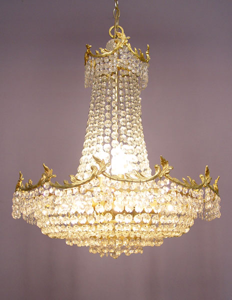 Appraisal: LIGHT GILT AND CRYSTAL CHANDELIER Gilt metal frame crystal chains