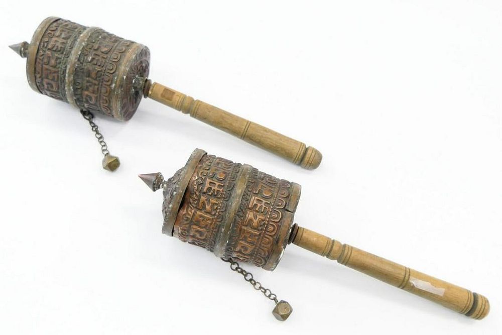 Appraisal: PAIR OF ANTIQUE TIBETAN PRAYER WHEELS WITH PRAYERS Each about