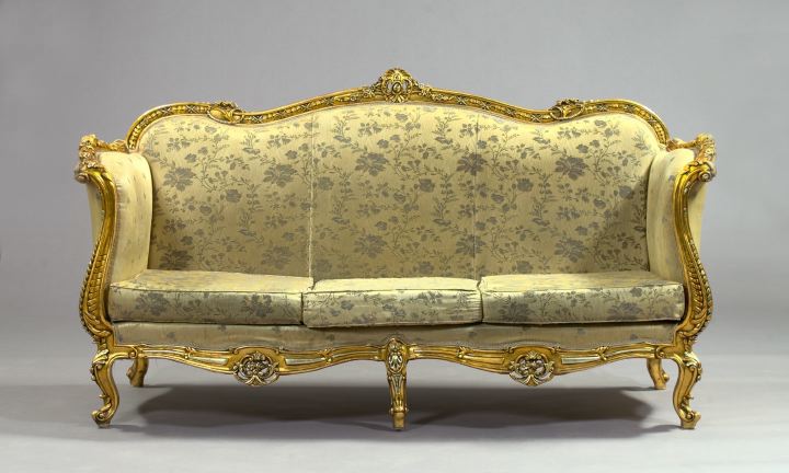 Appraisal: Louis XV-Style Giltwood Sofa the slightly domed and padded back