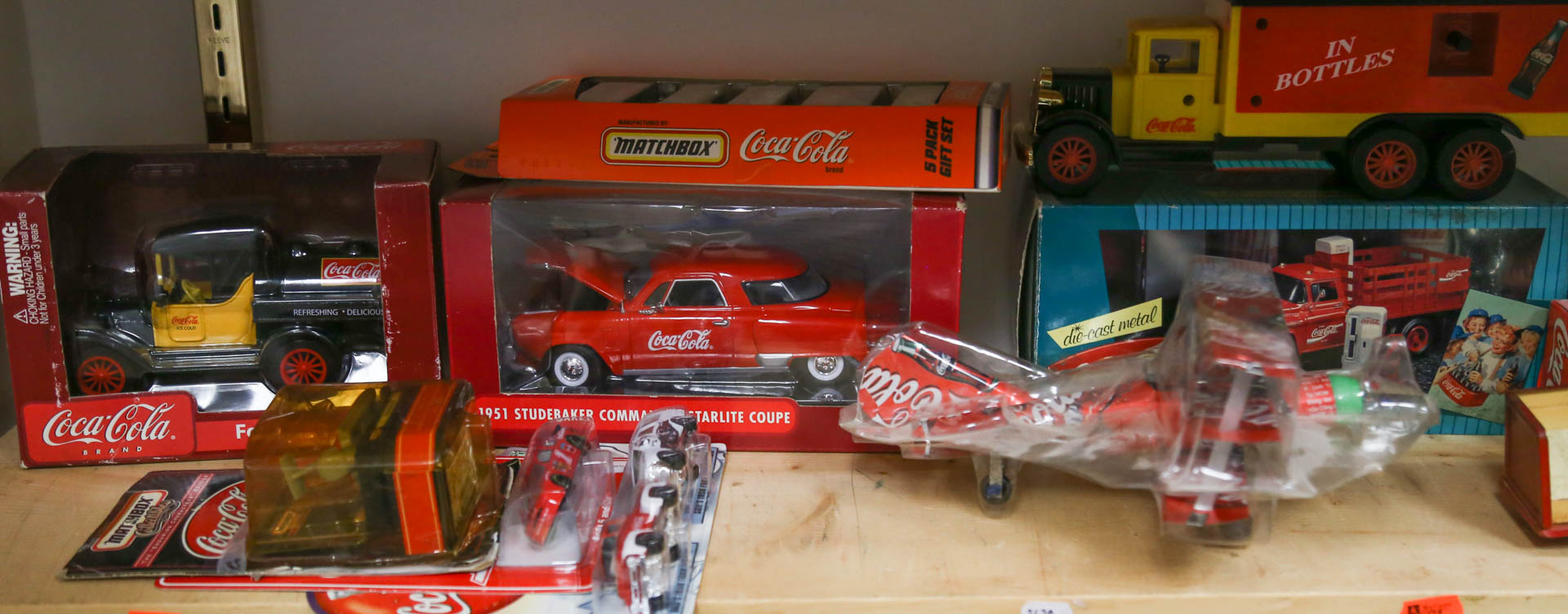 Appraisal: Assortment of Coca-Cola vehicles including a Buddy L truck Undernumber