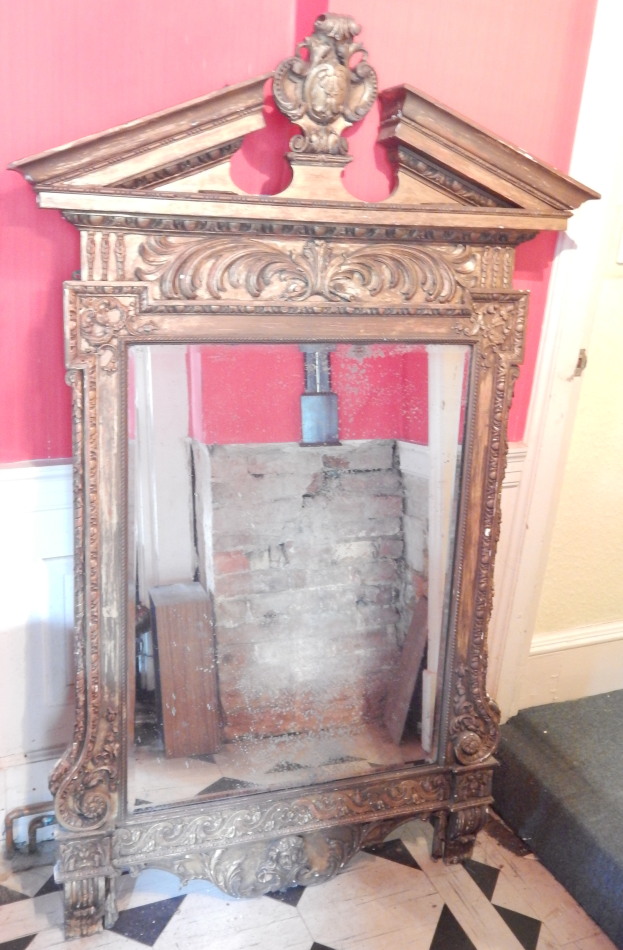 Appraisal: A thC gilt gesso wall mirror the broken pediment with