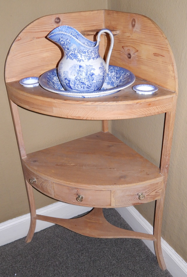 Appraisal: A thC stripped pine corner washstand with a shaped back