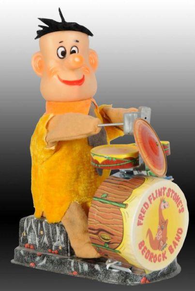 Appraisal: Japanese Fred Flintstone Bedrock Band Description Battery-operated Toy includes original