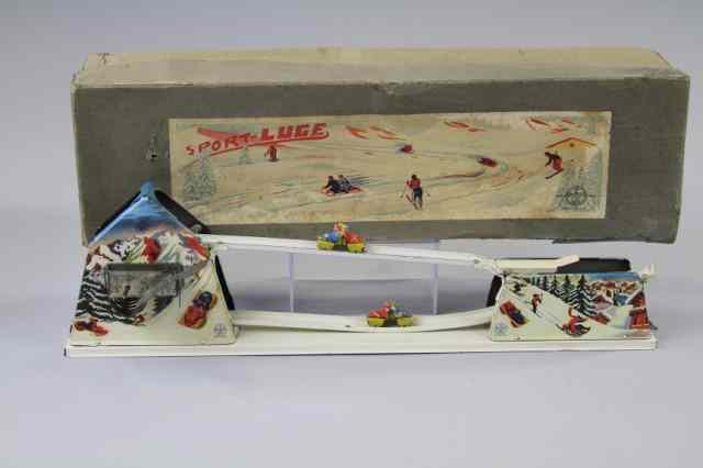 Appraisal: BOXED SPORT LUGE TOY France lithographed tin mountain graphics with