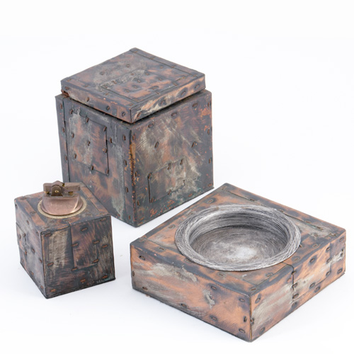 Appraisal: PAUL EVANS Copper bronze and pewter patchwork three-piece smoking set