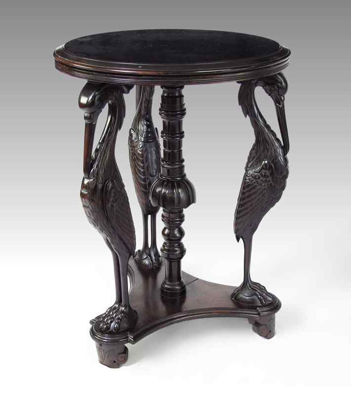 Appraisal: EBONIZED AESTHETIC MOVEMENT FIGURAL TABLE carved storks with carved and