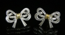 Appraisal: Tiffany Co Silver and Gold Earrings Sterling silver twisted bow