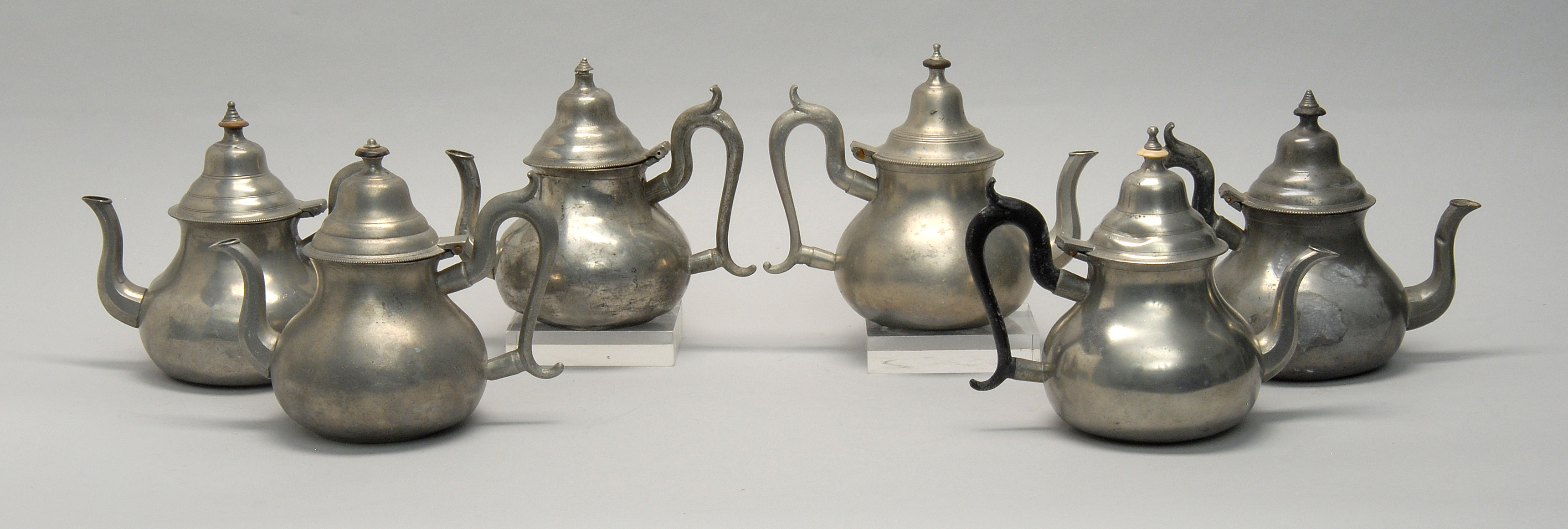 Appraisal: SIX ANTIQUE ENGLISH PEWTER TEAPOTS Late th Early th CenturyIncludes