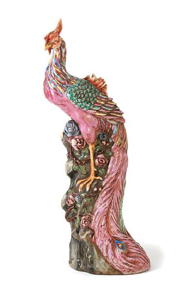 Appraisal: A Chinese famille rose enameled porcelain phoenix depicted standing on