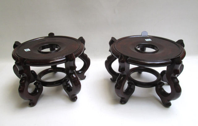 Appraisal: PAIR OF CHINESE ROSEWOOD STANDS of circular form and having