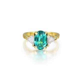 Appraisal: A Featuring a beautiful oval-shaped emerald weighing carats flanked by