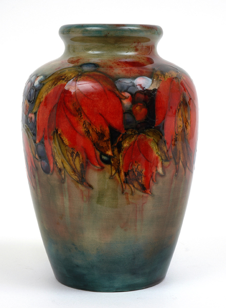 Appraisal: A MOORCROFT FLAMBE FRUIT AND LEAVES PATTERN VASE Circa Baluster