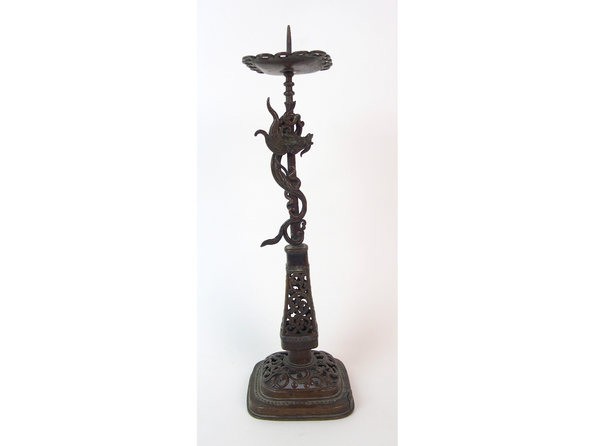 Appraisal: A Chinese pierced bronze pricket candlestickcast with a dragon entwined