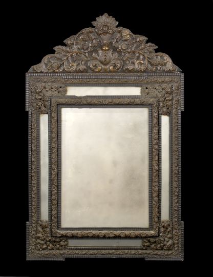 Appraisal: Franco-Flemish Embossed and Patinated Brass-Clad Looking Glass of cushion form