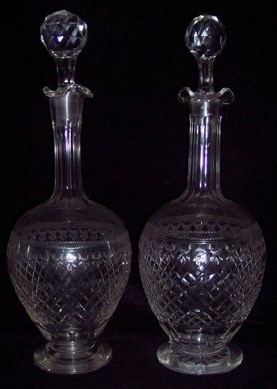 Appraisal: A pair of Edwardian cut glass sherry decanters and stoppers