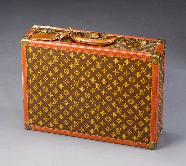 Appraisal: A Louis Vuitton hardcase suitcase first half th century height