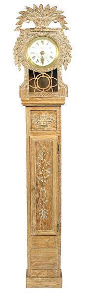 Appraisal: An Empire carved oak tall case clock now with electrical