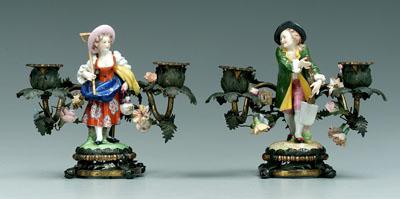 Appraisal: Pair porcelain and brass candelabra she with rake he with