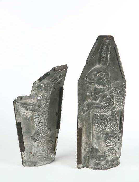 Appraisal: TWO CHOCOLATE MOLDS Tin with metal straps A seated rabbit