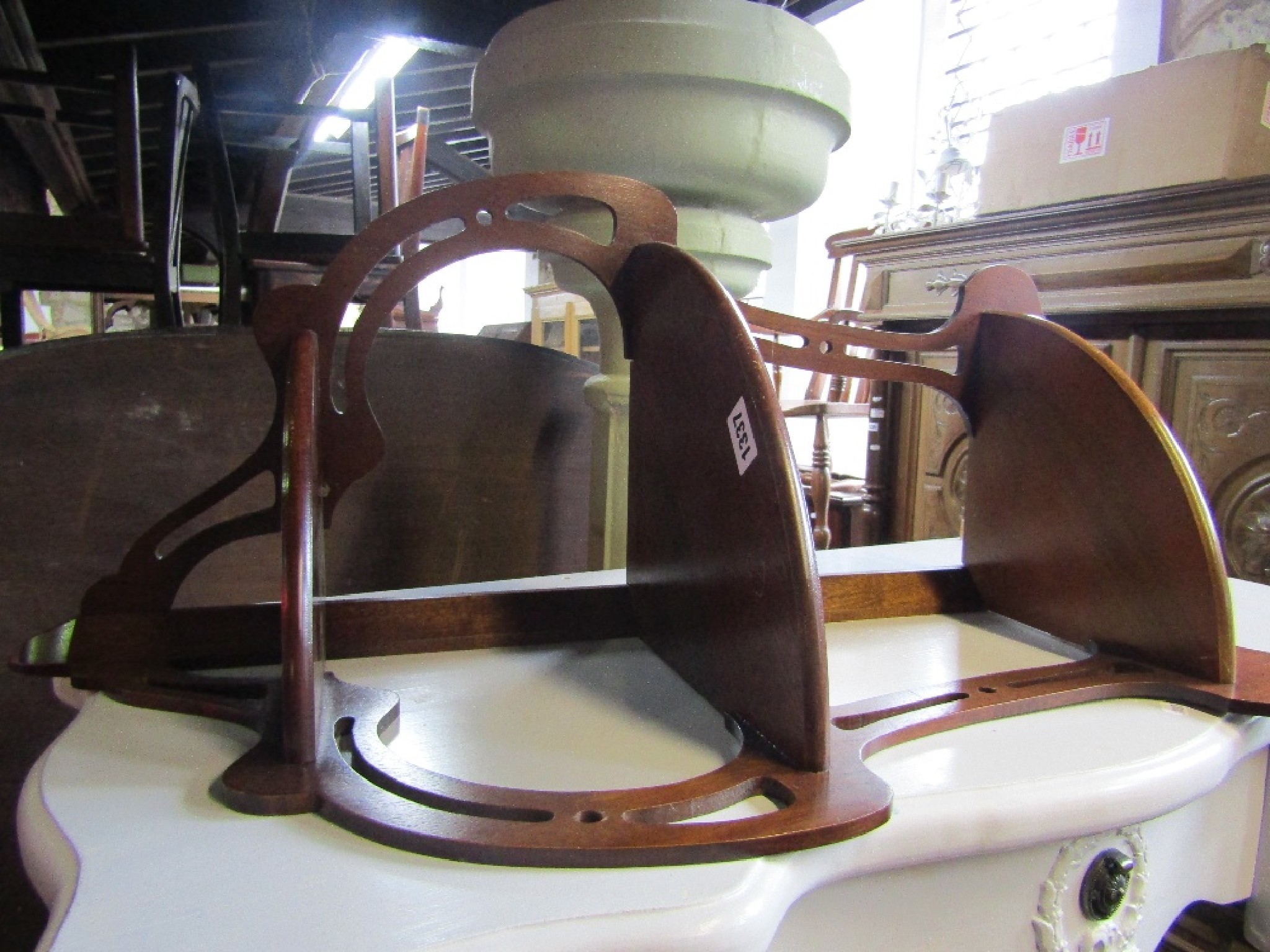 Appraisal: A mahogany corner wall shelf with pierced fretwork and shaped