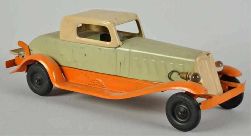 Appraisal: Pressed Steel Girard Deluxe Coupe Automobile Toy Description American Wind-up