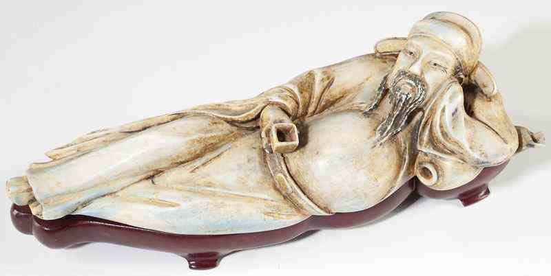 Appraisal: Chinese Ivory Reclining Figureearly th century depiction of a relaxed