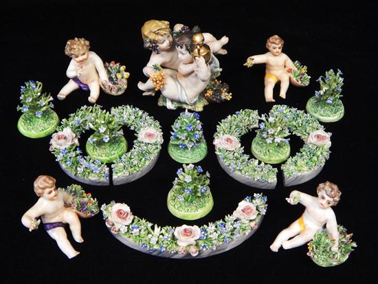 Appraisal: th C Capo di Monte ceramic Cupid figurines and floral