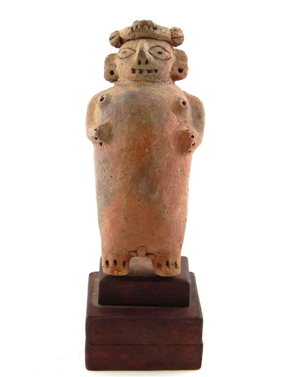 Appraisal: TRIBAL Pre-Mochica terracotta figure of a god Peruvian unglazed hermaphroditic