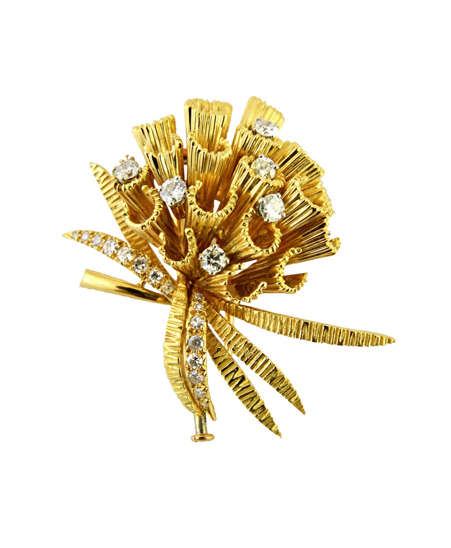 Appraisal: A gold and diamond set brooch designed as a floral