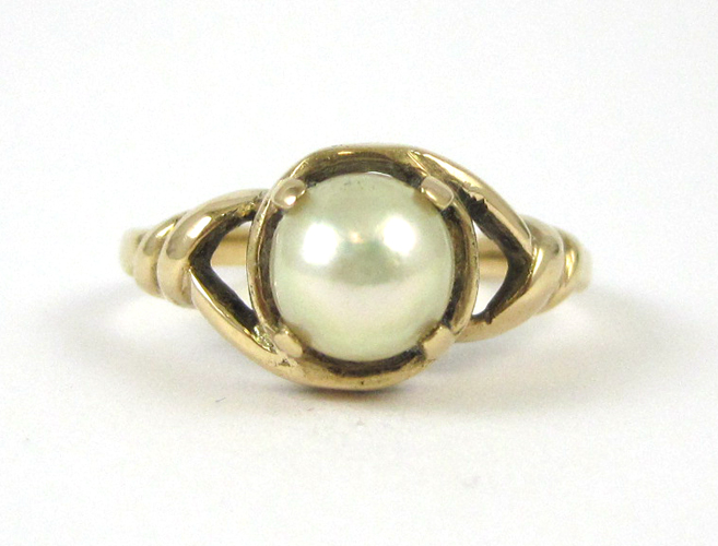 Appraisal: PEARL AND FOURTEEN KARAT GOLD RING set with a mm