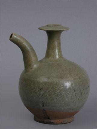 Appraisal: THAI SAWANKALOKE INCISED CELADON-GLAZED POTTERY KENDI The gobular footed bowl