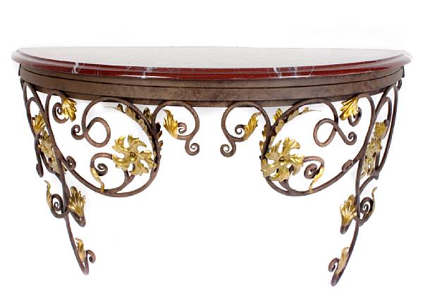 Appraisal: A pair of parcel gilt tole and wrought metal console