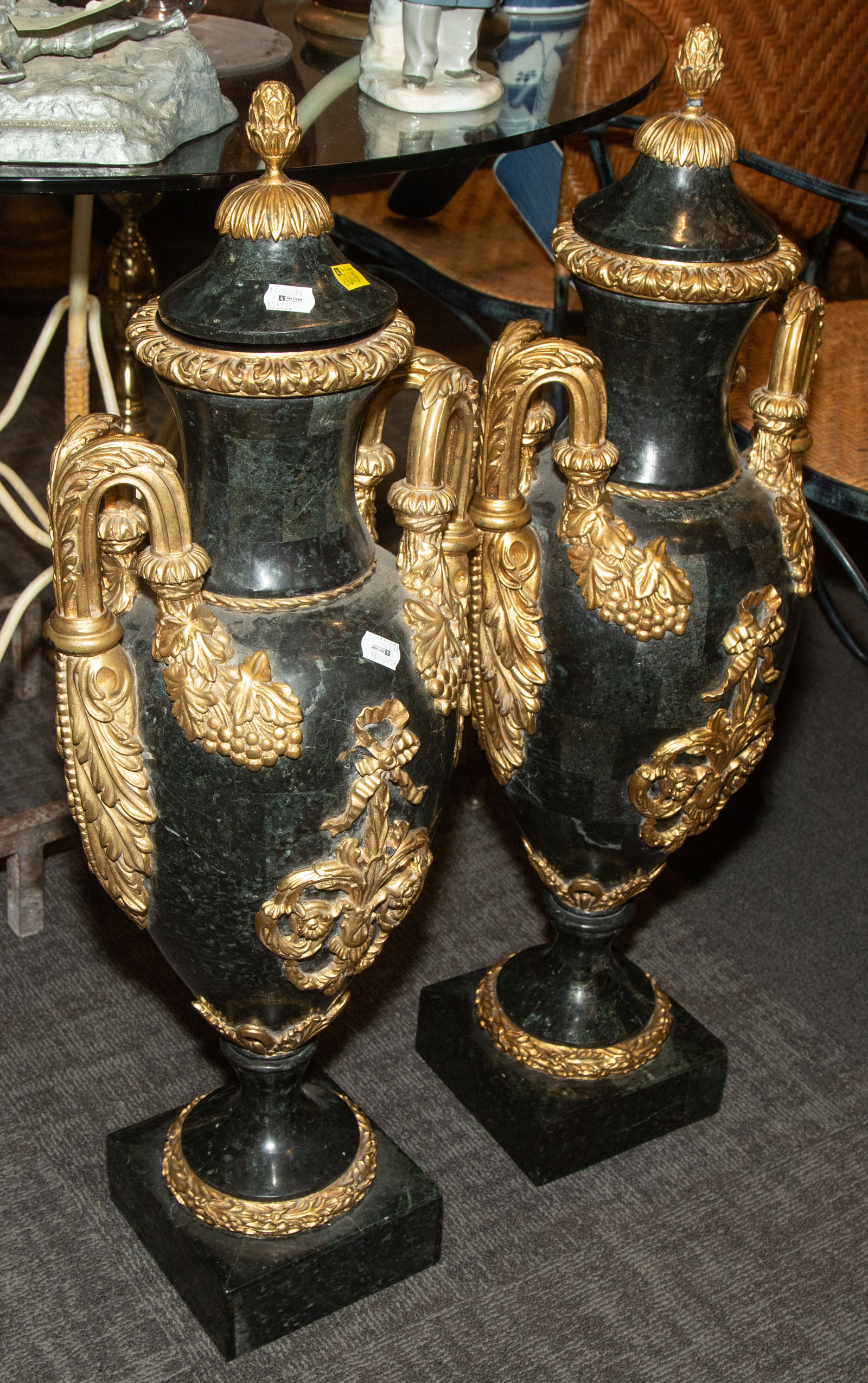 Appraisal: A PAIR OF LOUIS XVI STYLE URNS Modern Stone veneer