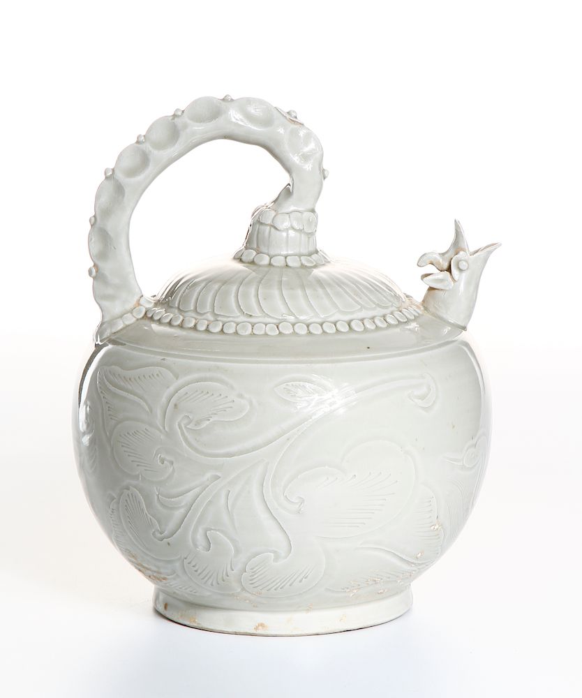 Appraisal: Chinese Rare White Glazed Relief-Carved Ewer Of globular body with