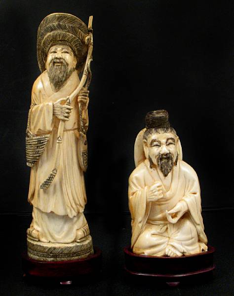 Appraisal: Two Chinese carved ivory figures of sages height in