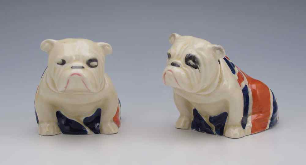 Appraisal: TWO ROYAL DOULTON BULLDOGS Draped in a Union Jack printed