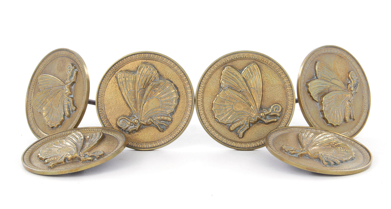 Appraisal: French brass tieback set circa cast-brass butterfly design Dia L