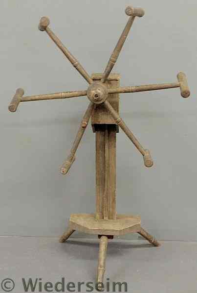 Appraisal: Early wool winder mounted on a tri-leg base h