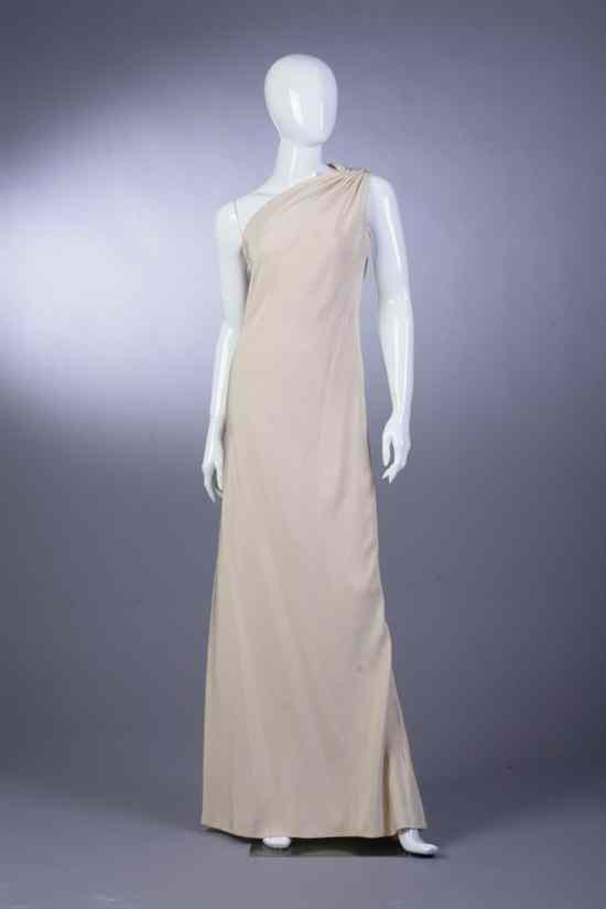 Appraisal: GEOFFREY BEENE CHAMPAGNE COLORED ONE-SHOULDERED EVENING GOWN Lurex fabric bias-cut