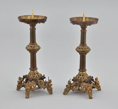 Appraisal: A Pair of Gilt Candle Holders Column holders with pierced