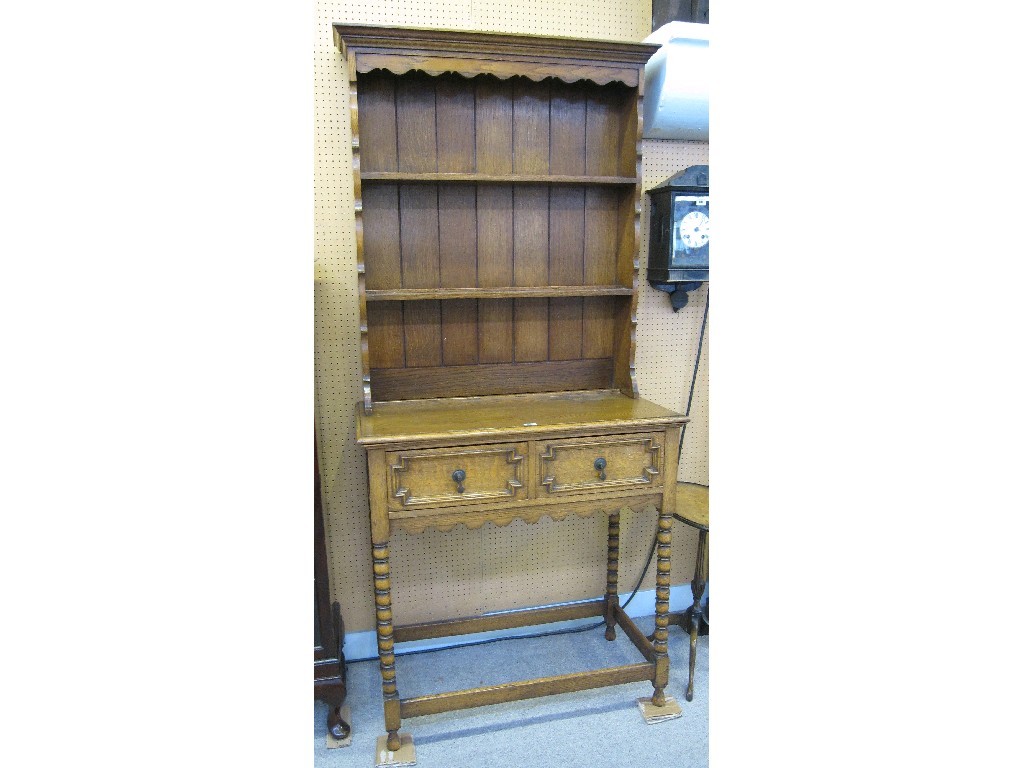 Appraisal: Oak dresser with platerack on bobbin turned supports