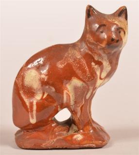 Appraisal: Mottle Glazed Redware Pottery of a Seated Cat Mottle Glazed