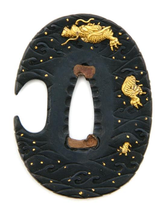 Appraisal: A Gold on Shakudo Tsuba th century Goto or Yoshioka