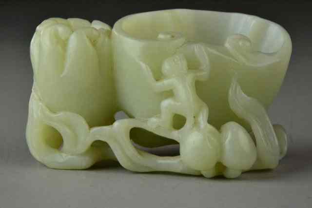 Appraisal: A Fine Chinese Carved White Jade Brush WashFinely carved in