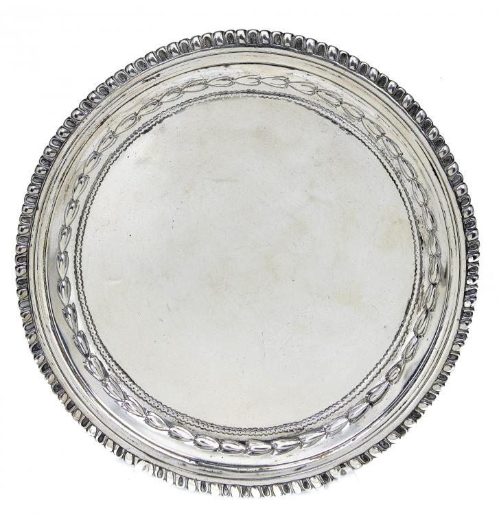 Appraisal: A GEORGE III WAITER with plain field the cavetto embossed