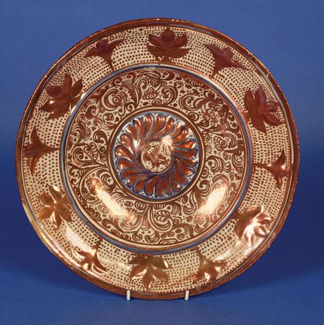 Appraisal: A HISPANO MORESQUE STYLE LUSTRE CHARGER the border modelled in