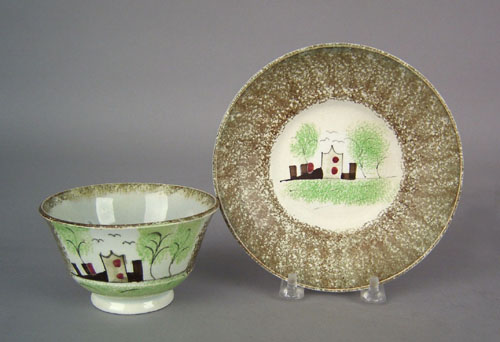 Appraisal: Olive green brown spatter cup and saucer th c with