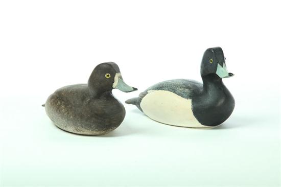 Appraisal: TWO DECOYS American late th century carved wood Two decoys